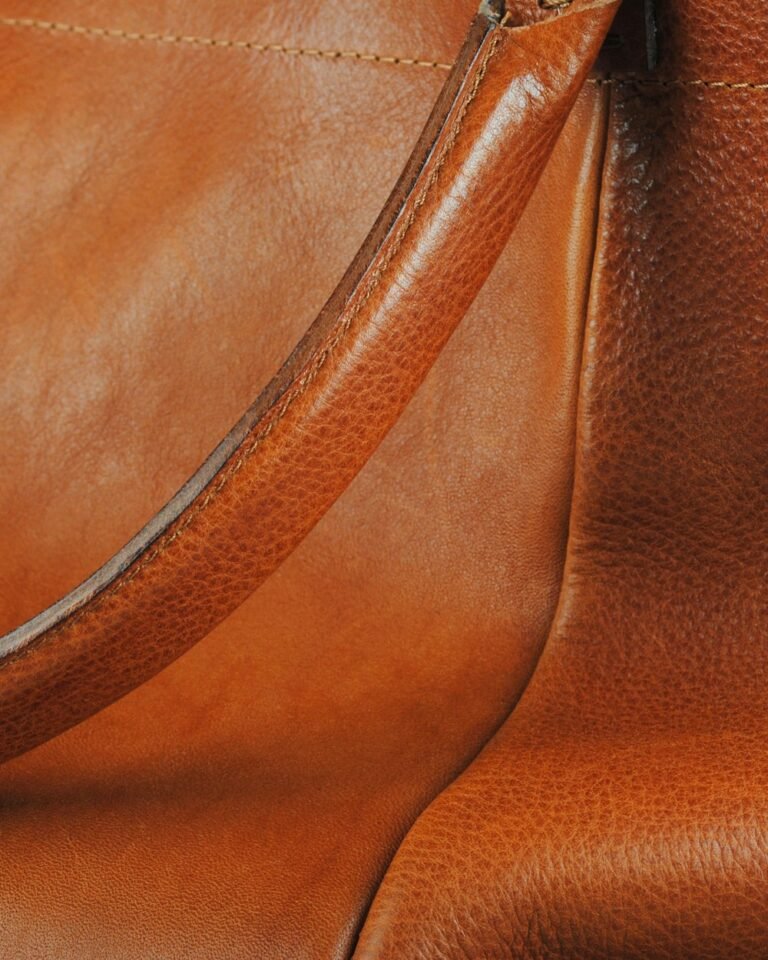 Brown leather handbag, editorial neutral