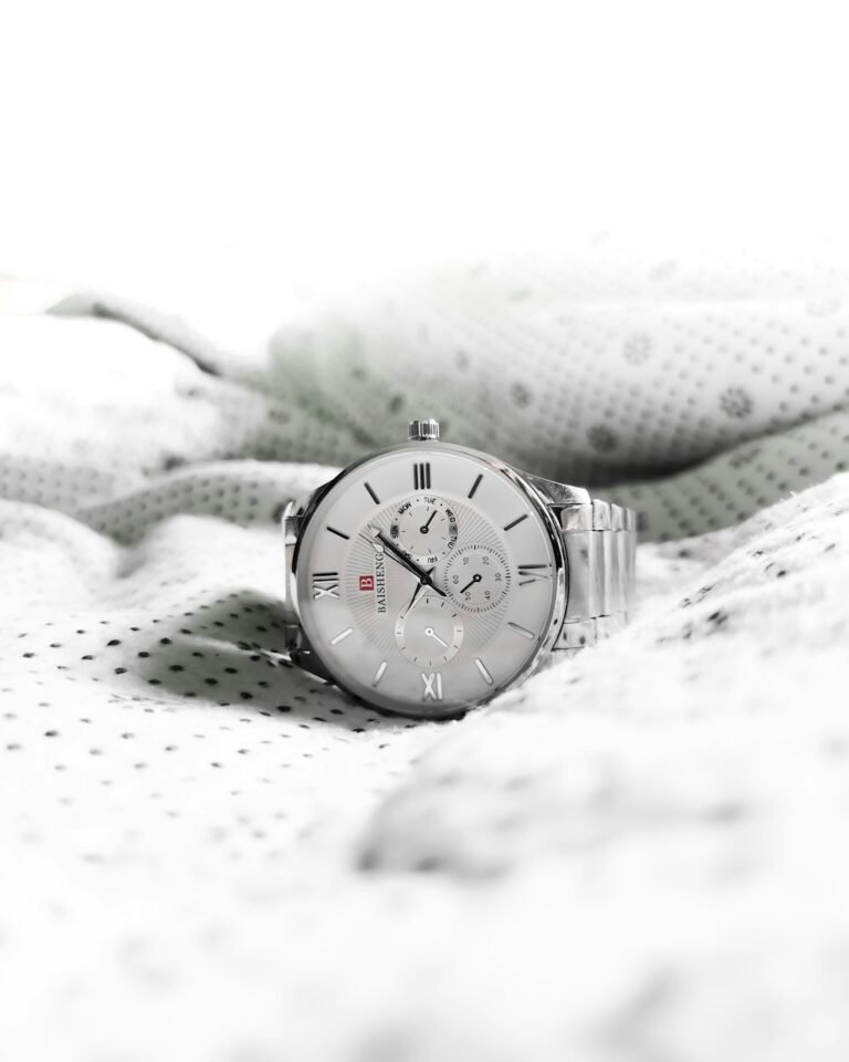 Luxury watch on neutral white surface
